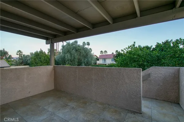 a view of balcony and tree