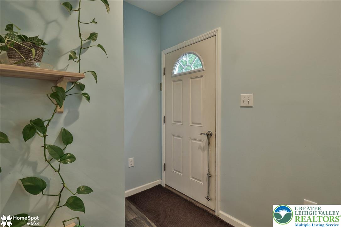 318 Church Road Kunkletown, PA 18058 - Photo 8 of 51 A classic front door with an arched window welcomes you into a serene interior space.