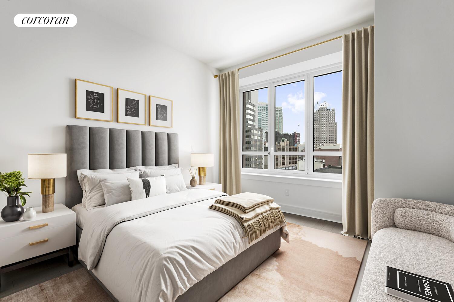 265 State Street, Unit 812 Brooklyn, NY 11201 - Photo 4 of 6 a bedroom with a bed and a couch next to a window