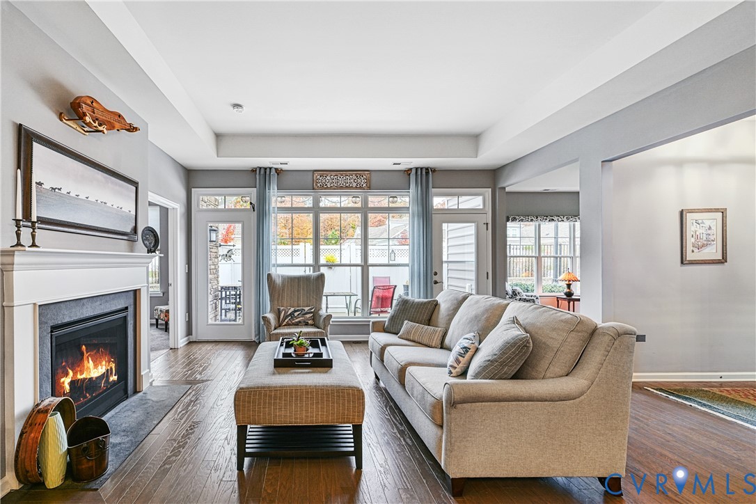 1009 Woodlet Meadow Lane Richmond, VA 23236 - Photo 11 of 44 a living room with furniture and a fireplace