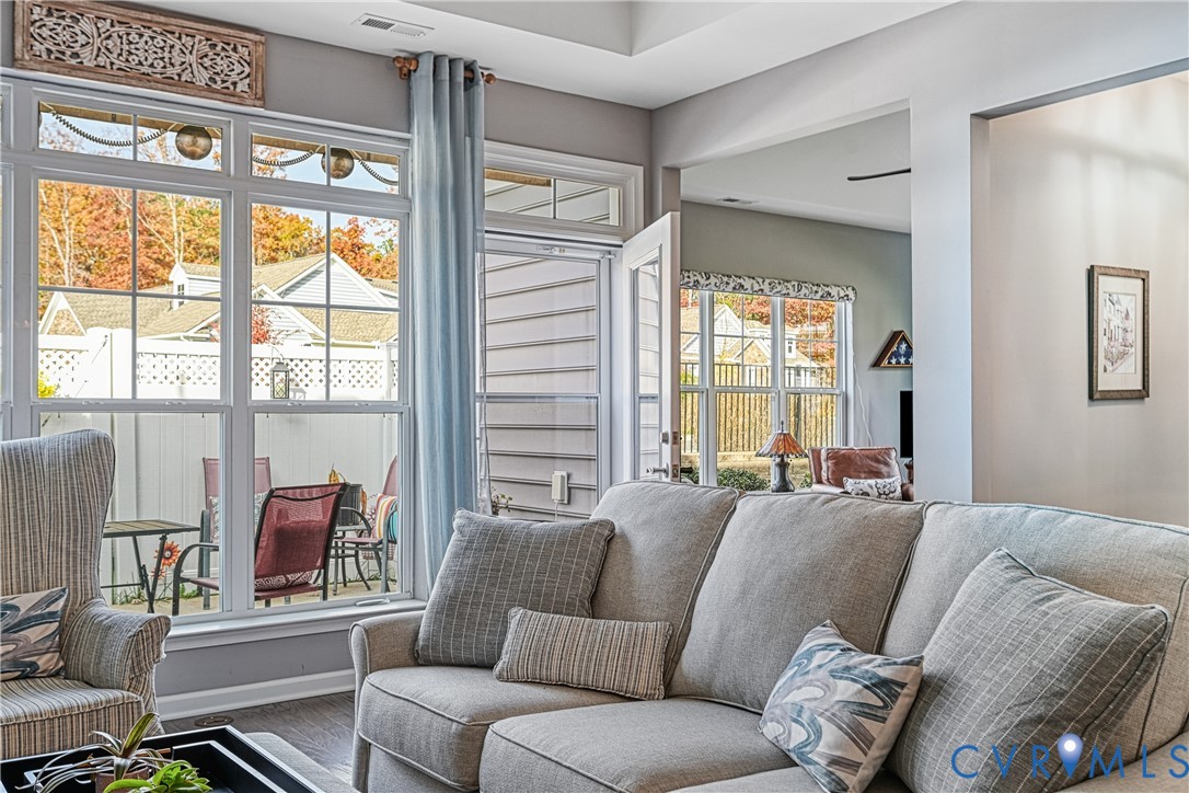 1009 Woodlet Meadow Lane Richmond, VA 23236 - Photo 14 of 44 a living room with furniture and a window