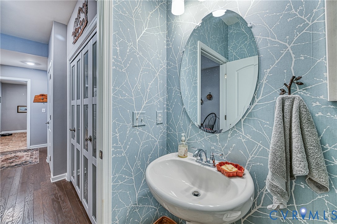 1009 Woodlet Meadow Lane Richmond, VA 23236 - Photo 15 of 44 a bathroom with a sink and a mirror