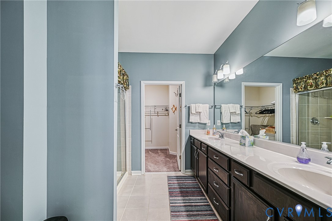 1009 Woodlet Meadow Lane Richmond, VA 23236 - Photo 22 of 44 a large bathroom with a double vanity sink and a mirror
