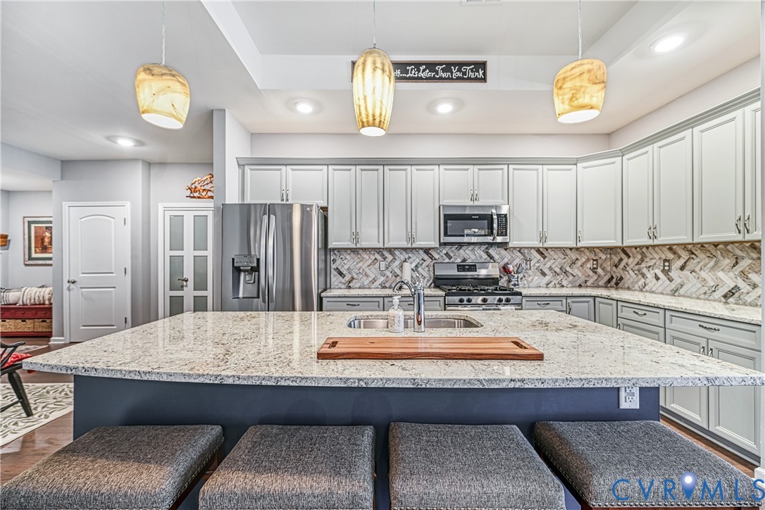 1009 Woodlet Meadow Lane Richmond, VA 23236 - Photo 4 of 44 a kitchen with a refrigerator and microwave