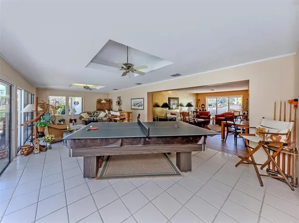 a living room with lots of furniture a table and chairs