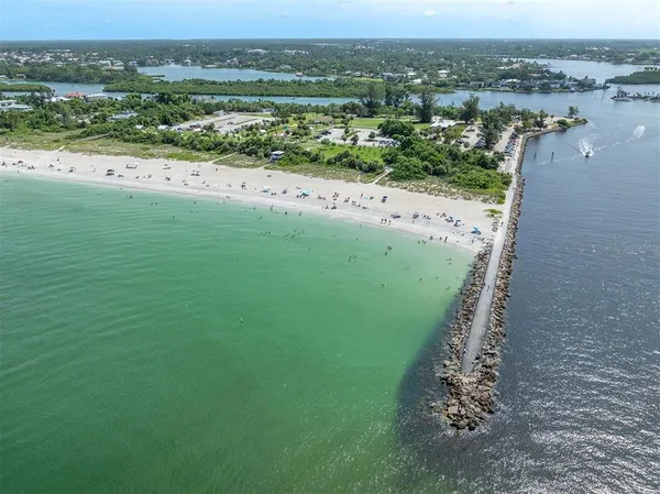 an aerial view of a houses with a yard