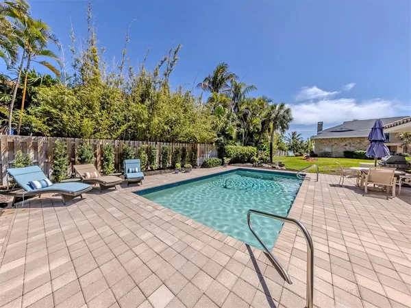 a view of a swimming pool with a lounge chairs
