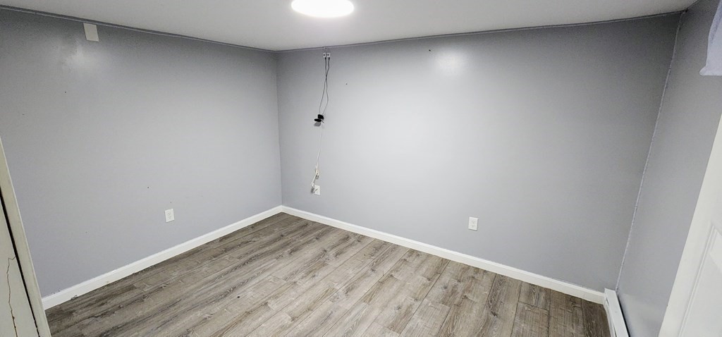 212 Vernon Street Worcester, MA 01607 - Photo 13 of 35 a view of room with wooden floor