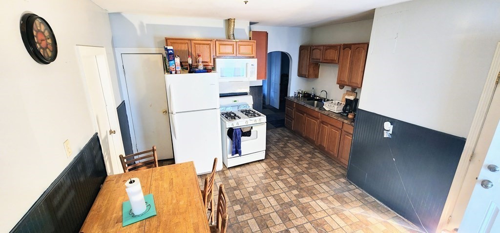 212 Vernon Street Worcester, MA 01607 - Photo 19 of 35 a kitchen with stainless steel appliances a refrigerator sink and a stove