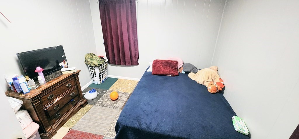 212 Vernon Street Worcester, MA 01607 - Photo 20 of 35 a living room with furniture and a flat screen tv