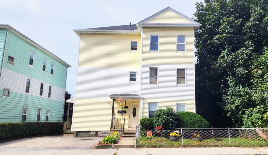 212 Vernon Street Worcester, MA 01607 - Photo 2 of 35 a front view of a house with plants