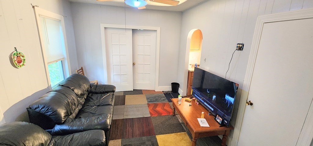 212 Vernon Street Worcester, MA 01607 - Photo 23 of 35 a living room with furniture and a flat screen tv