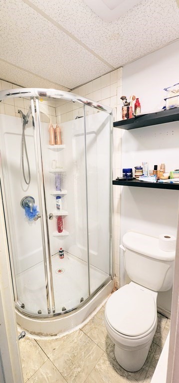 212 Vernon Street Worcester, MA 01607 - Photo 25 of 35 a bathroom with a toilet and a shower