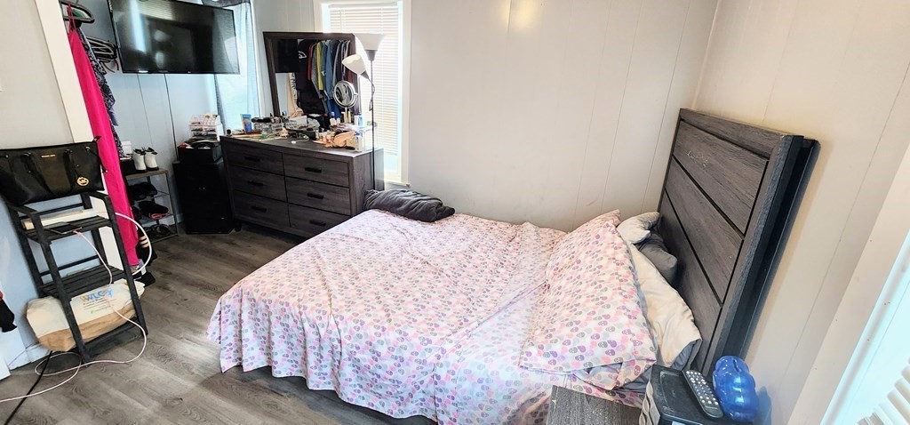 212 Vernon Street Worcester, MA 01607 - Photo 35 of 35 a bedroom with a bed closet and a mirror