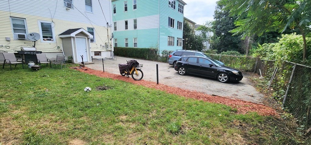 212 Vernon Street Worcester, MA 01607 - Photo 5 of 35 a view of a car is parked in front of a house