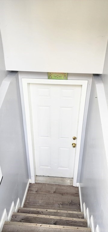 212 Vernon Street Worcester, MA 01607 - Photo 9 of 35 a view of closet with wooden floor