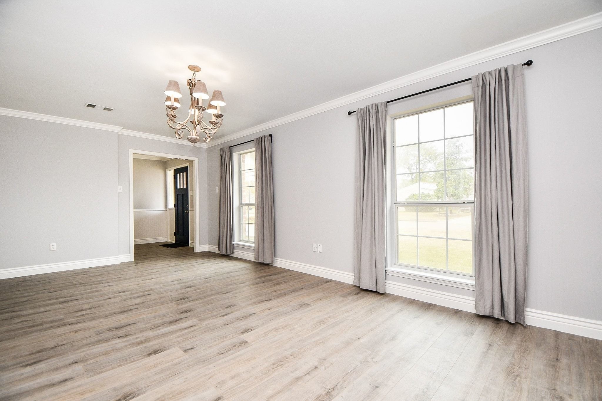 14011 Wickersham Lane Houston, TX 77077 - Photo 7 of 38 Spacious formal dining just off foyer and overlooking front yard.