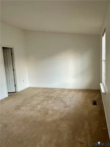 an empty room with a natural light