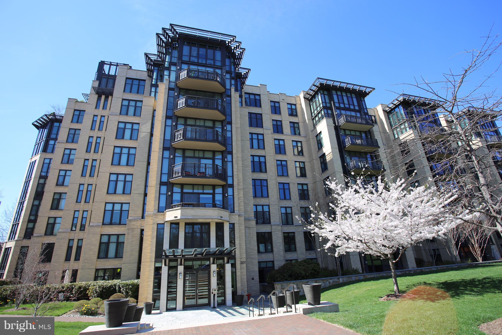 4301 Military Road Northwest, Unit 514 Washington, DC 20015 - Photo 1 of 29 a front view of a building with garden