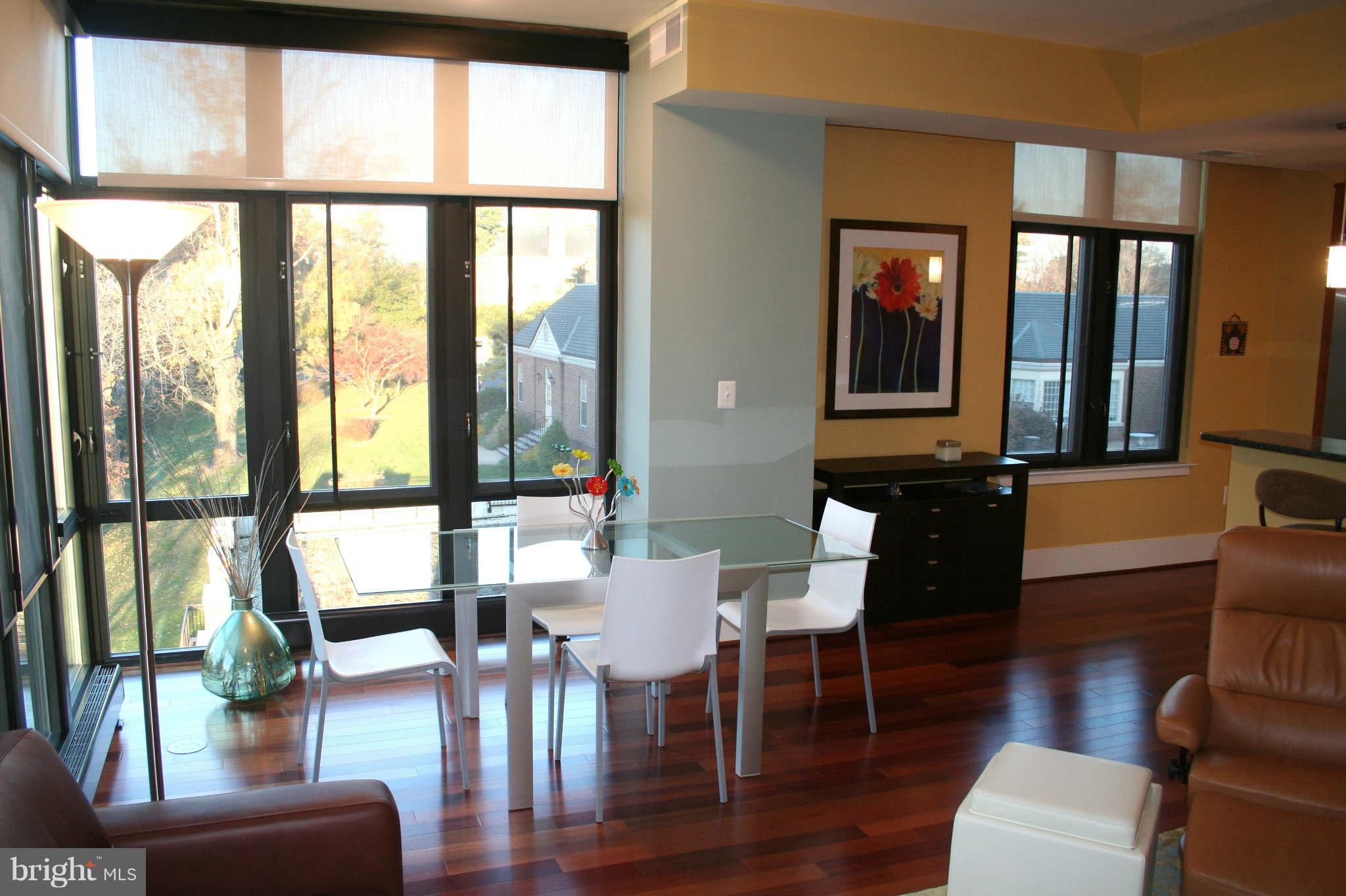 4301 Military Road Northwest, Unit 514 Washington, DC 20015 - Photo 6 of 29 a view of a livingroom with furniture window and wooden floor