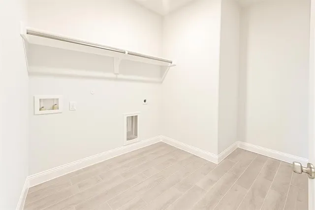 a view of a small space with wooden floor