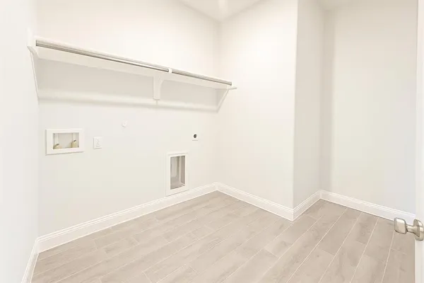 a view of a small space with wooden floor