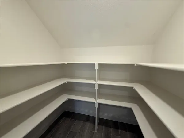 a storage room with wooden floor