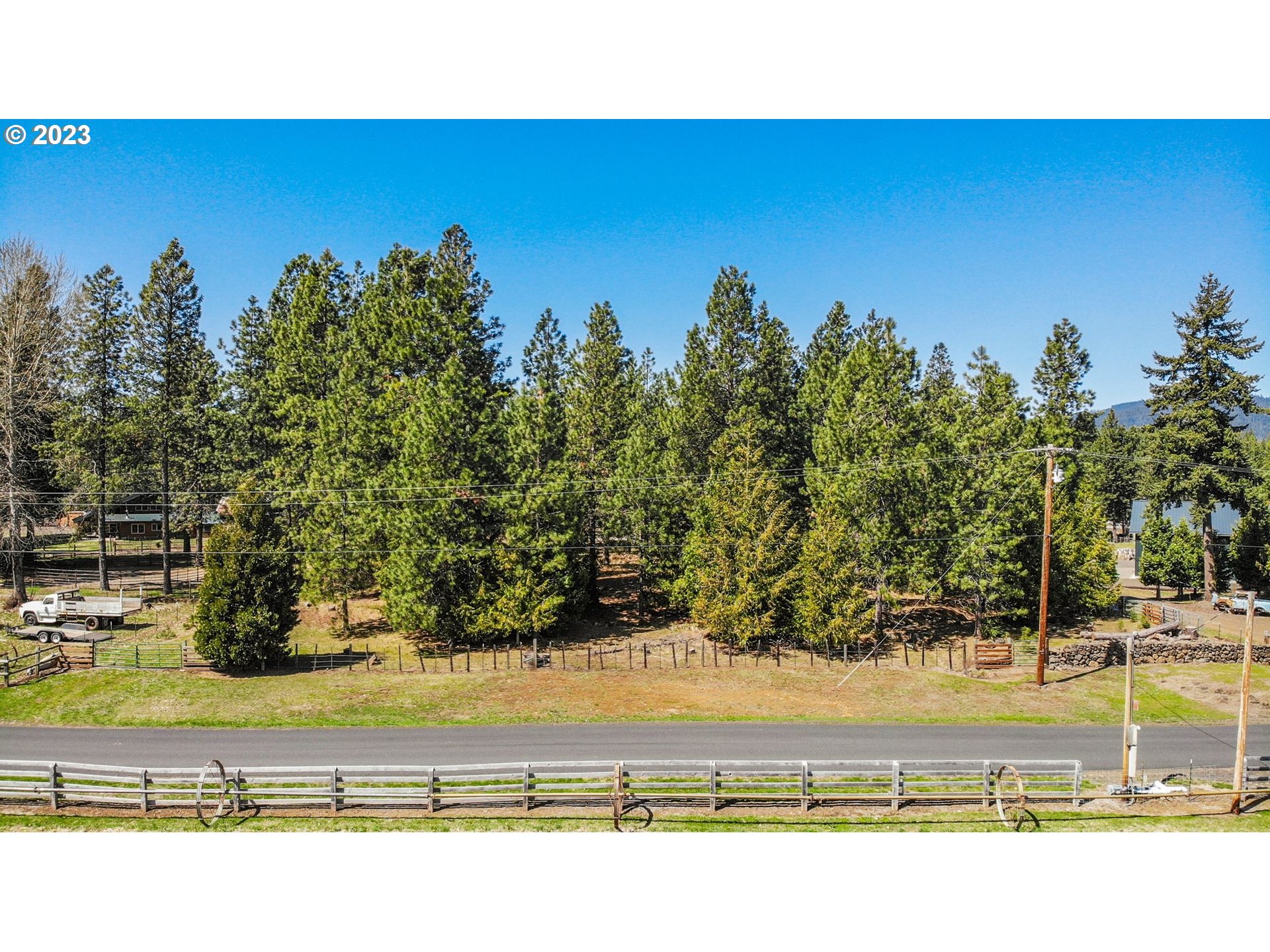 69 Jennings Road Trout Lake, WA 98650 - Photo 11 of 38 a view of a swimming pool with an outdoor space and seating area