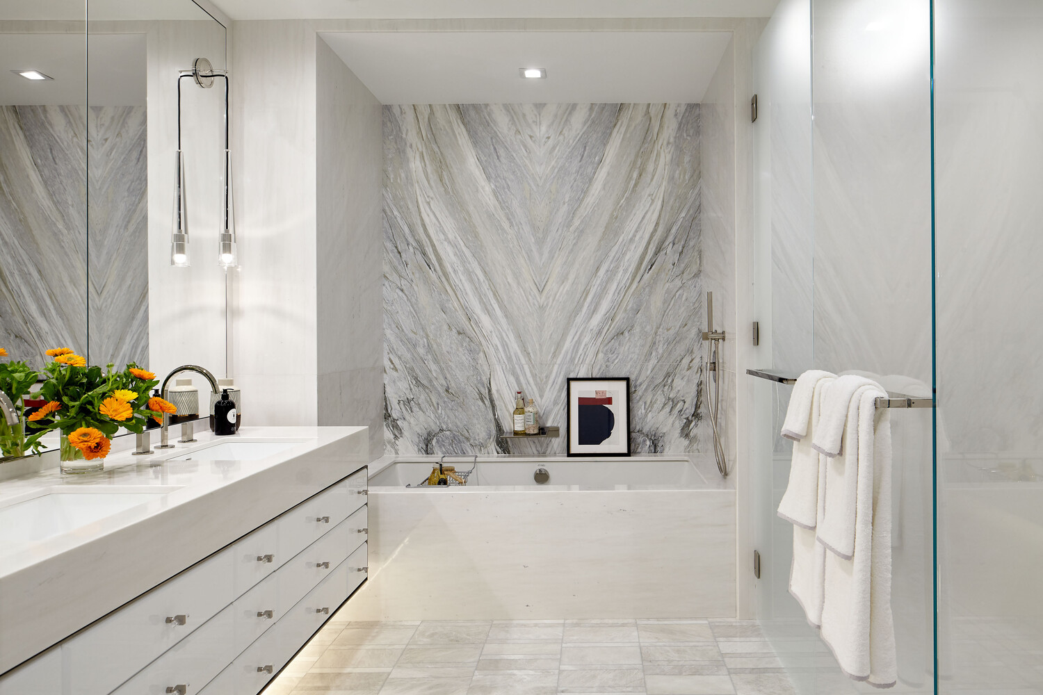 200 Amsterdam Avenue, Unit 11C Manhattan, NY 10023 - Photo 4 of 7 a bathroom with a sink a mirror and a bathtub