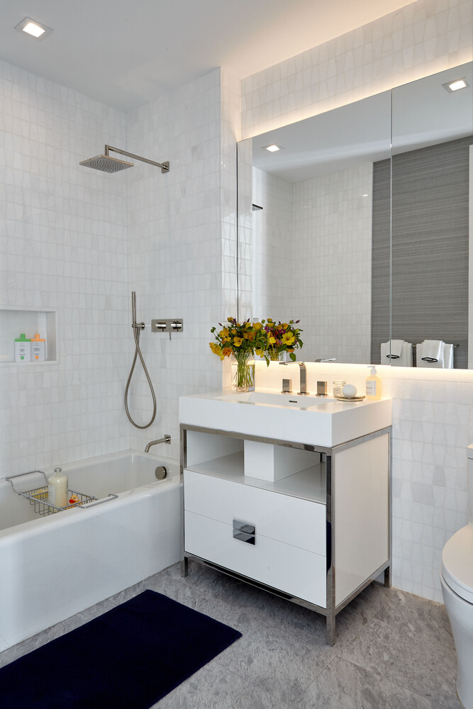 200 Amsterdam Avenue, Unit 11C Manhattan, NY 10023 - Photo 6 of 7 a bathroom with a sink double vanity and a bathtub