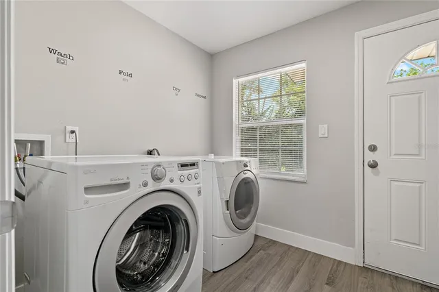 a view of livingroom with washer and dryer