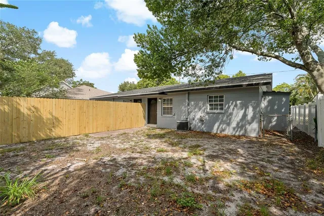 a house with trees in the background