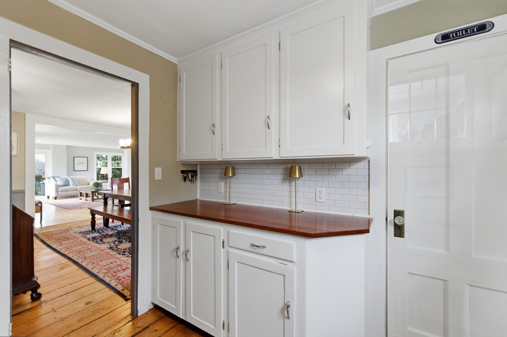 8 Linden Street Marblehead, MA 01945 - Photo 15 of 41 a kitchen with white cabinets and sink