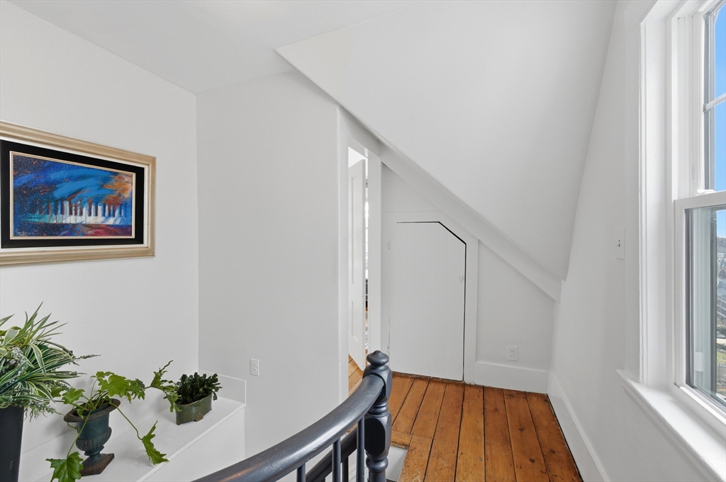 8 Linden Street Marblehead, MA 01945 - Photo 21 of 41 a view of a hallway with wooden floor and front door
