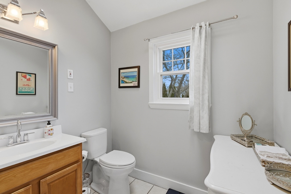 8 Linden Street Marblehead, MA 01945 - Photo 25 of 41 a bathroom with a sink toilet and window