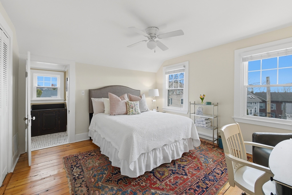 8 Linden Street Marblehead, MA 01945 - Photo 27 of 41 a bedroom with a bed and wooden floor