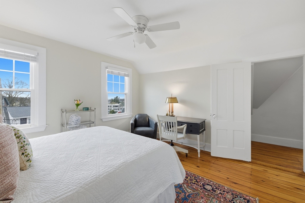 8 Linden Street Marblehead, MA 01945 - Photo 28 of 41 a bedroom with a bed and wooden floor