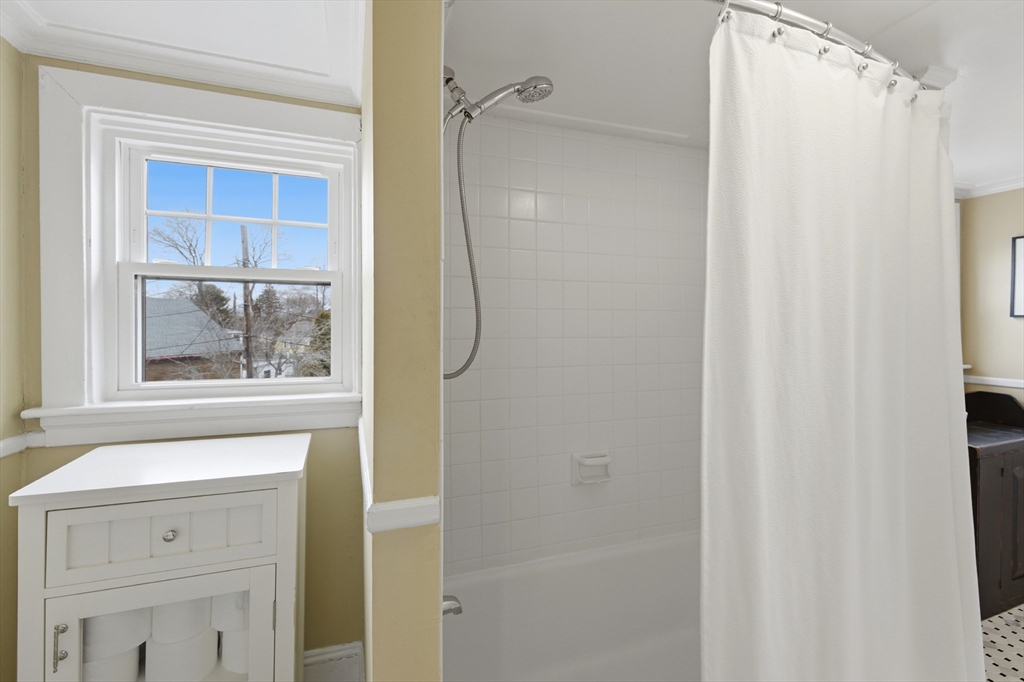8 Linden Street Marblehead, MA 01945 - Photo 30 of 41 a bathroom with a shower and a window