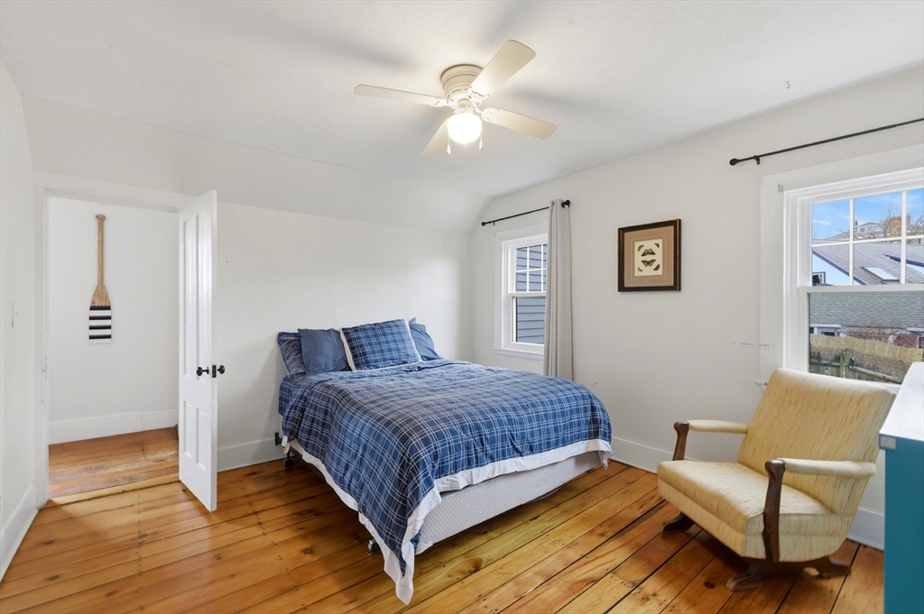 8 Linden Street Marblehead, MA 01945 - Photo 31 of 41 a bedroom with a bed and a chair