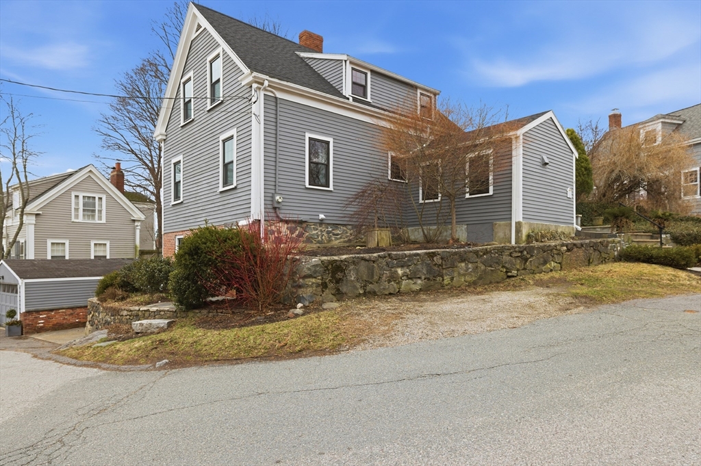 8 Linden Street Marblehead, MA 01945 - Photo 41 of 41 a view of a blue house with a yard in front of it