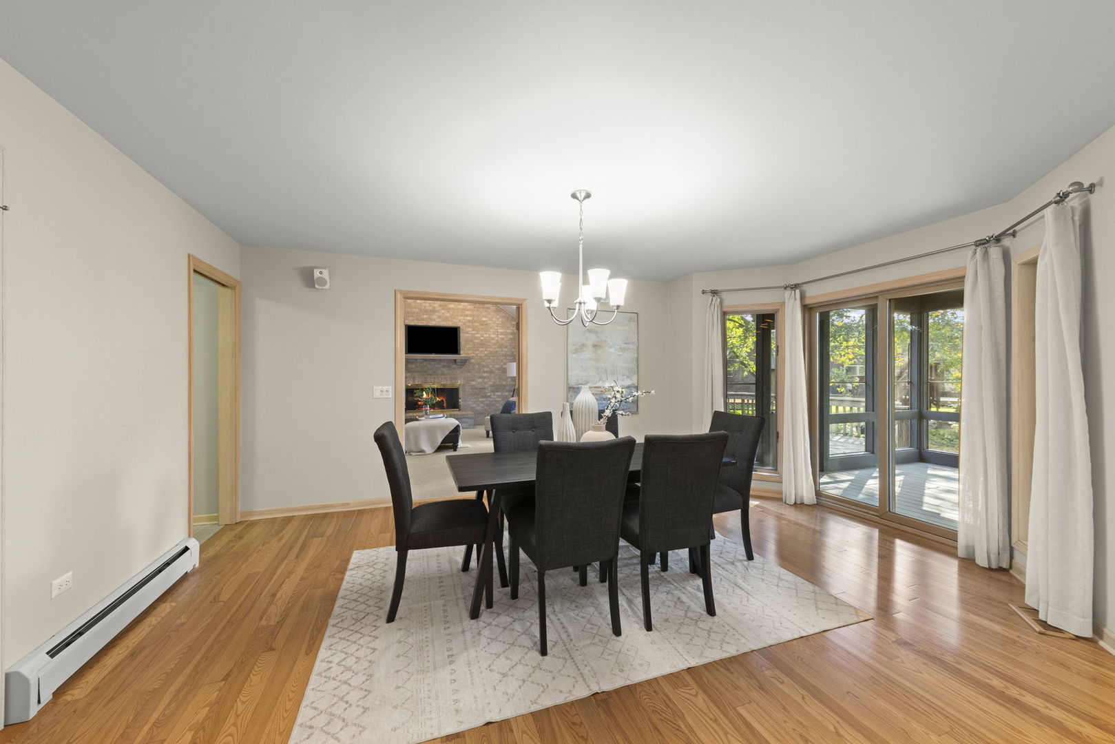 1048 Parkside Road Naperville, IL 60540 - Photo 6 of 35 a view of a dining room with furniture window and wooden floor