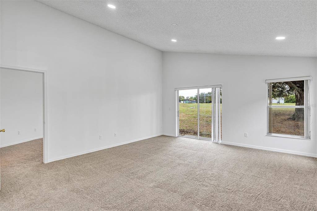 4254 Northern Dancer Way Orlando, FL 32826 - Photo 11 of 38 an empty room with windows