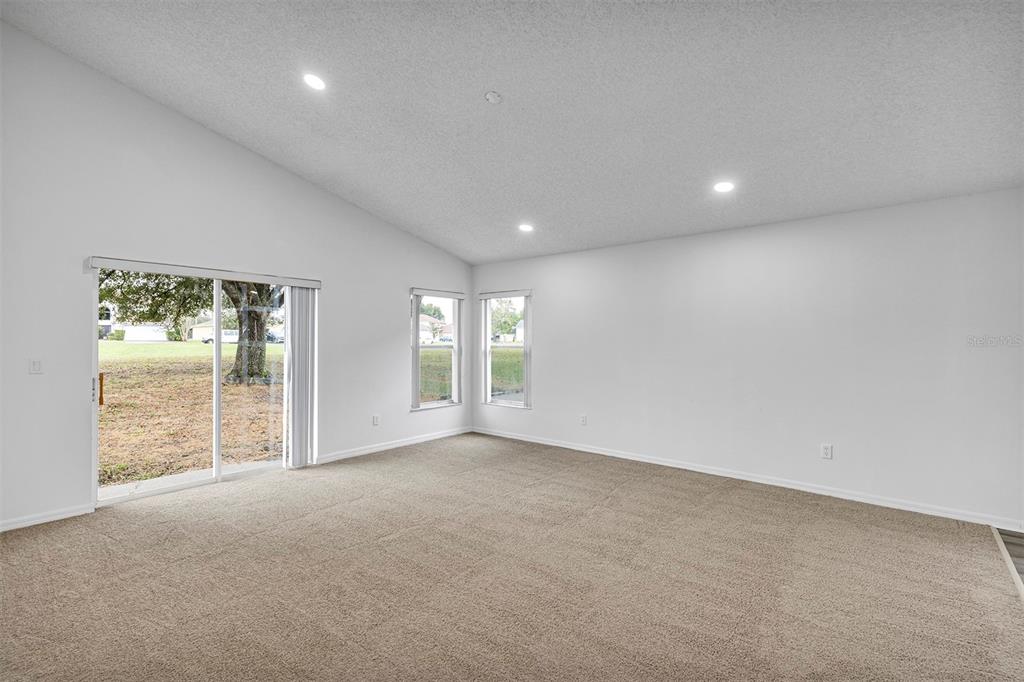 4254 Northern Dancer Way Orlando, FL 32826 - Photo 12 of 38 a view of an empty room with a window