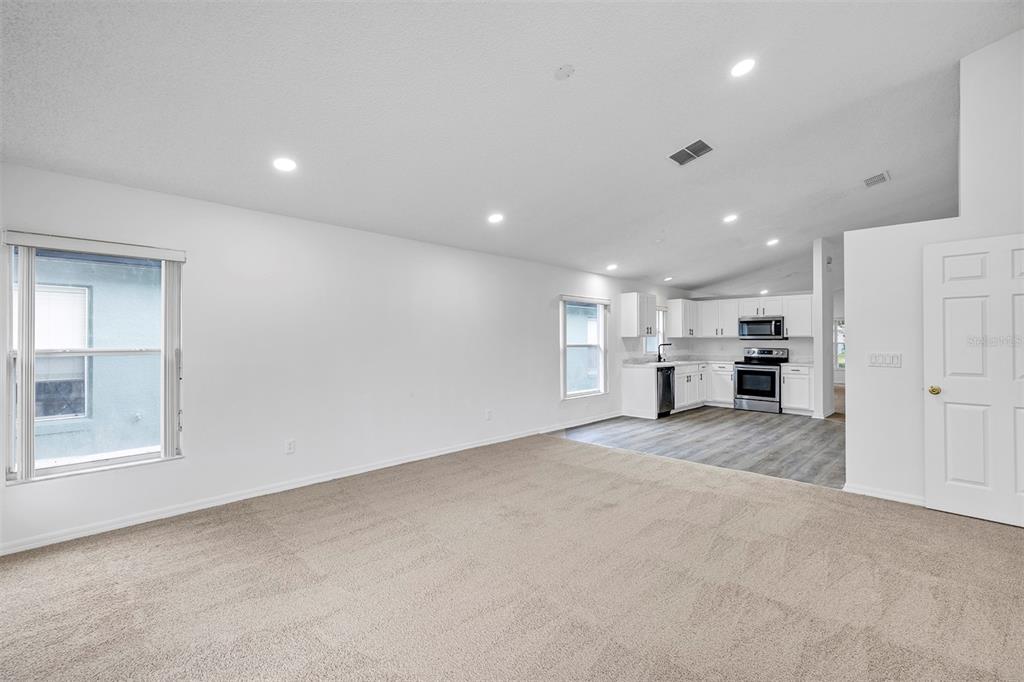 4254 Northern Dancer Way Orlando, FL 32826 - Photo 13 of 38 a view of kitchen and kitchen island