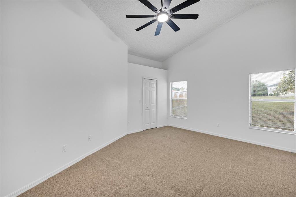 4254 Northern Dancer Way Orlando, FL 32826 - Photo 15 of 38 an empty room with windows and fan