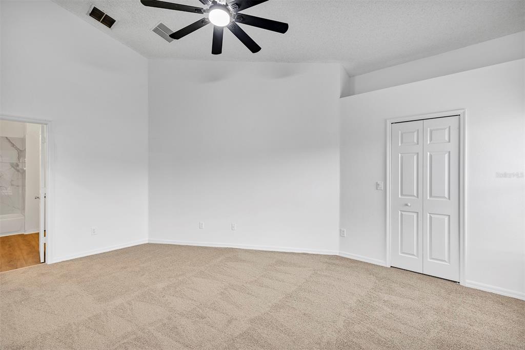 4254 Northern Dancer Way Orlando, FL 32826 - Photo 16 of 38 a view of a big room with a ceiling fan