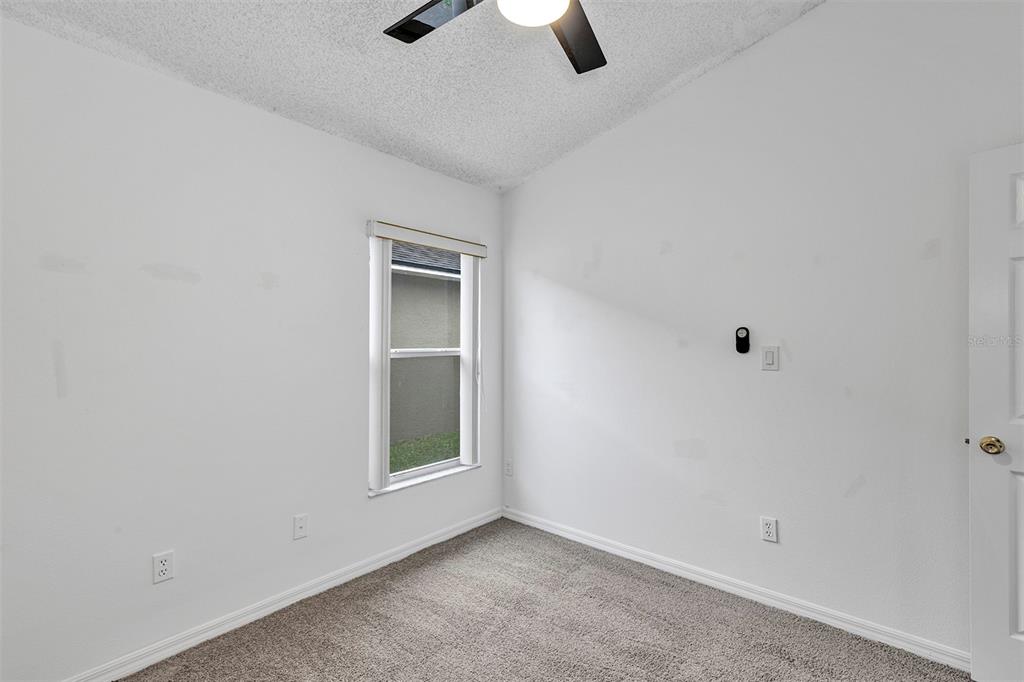 4254 Northern Dancer Way Orlando, FL 32826 - Photo 25 of 38 an empty room with a empty space and a window