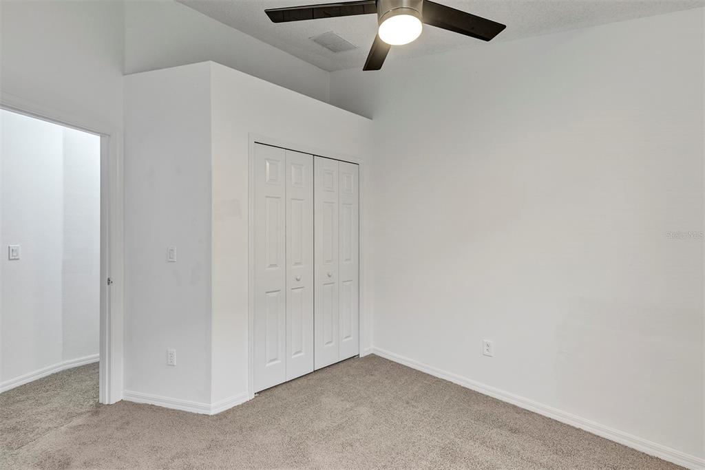 4254 Northern Dancer Way Orlando, FL 32826 - Photo 27 of 38 an empty room with fan