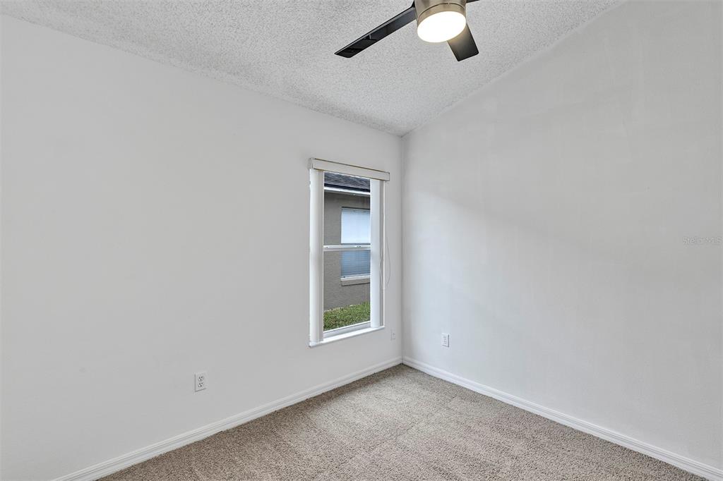 4254 Northern Dancer Way Orlando, FL 32826 - Photo 29 of 38 an empty room with window and fan
