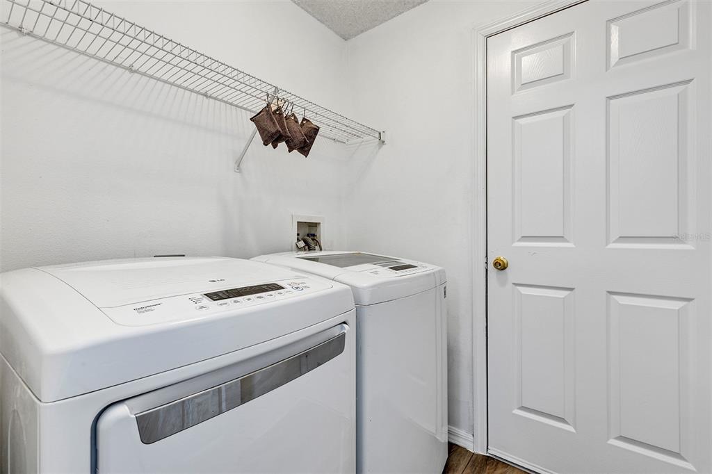 4254 Northern Dancer Way Orlando, FL 32826 - Photo 32 of 38 a utility room with dryer and washer